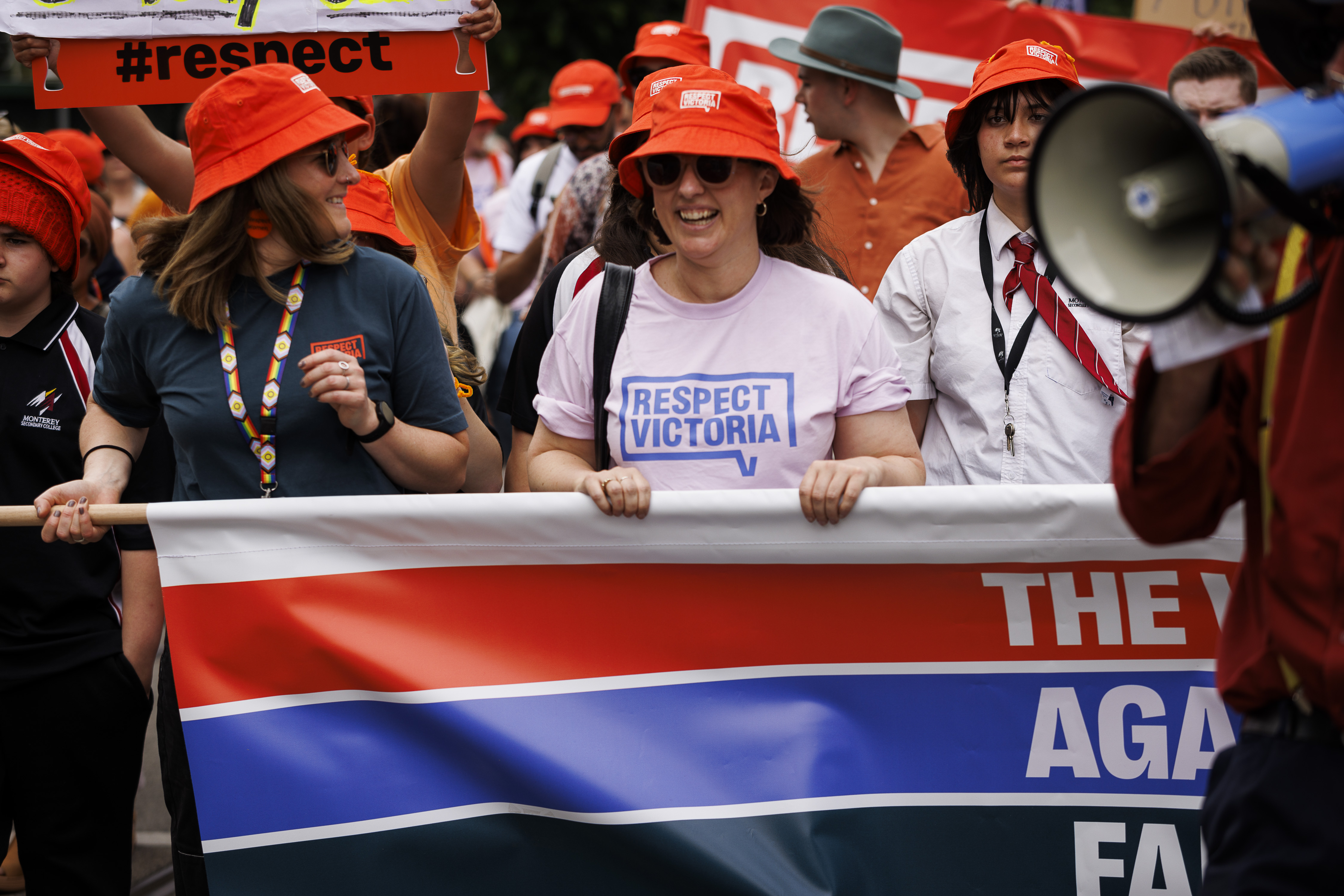 woman holding banner at walk against family violence